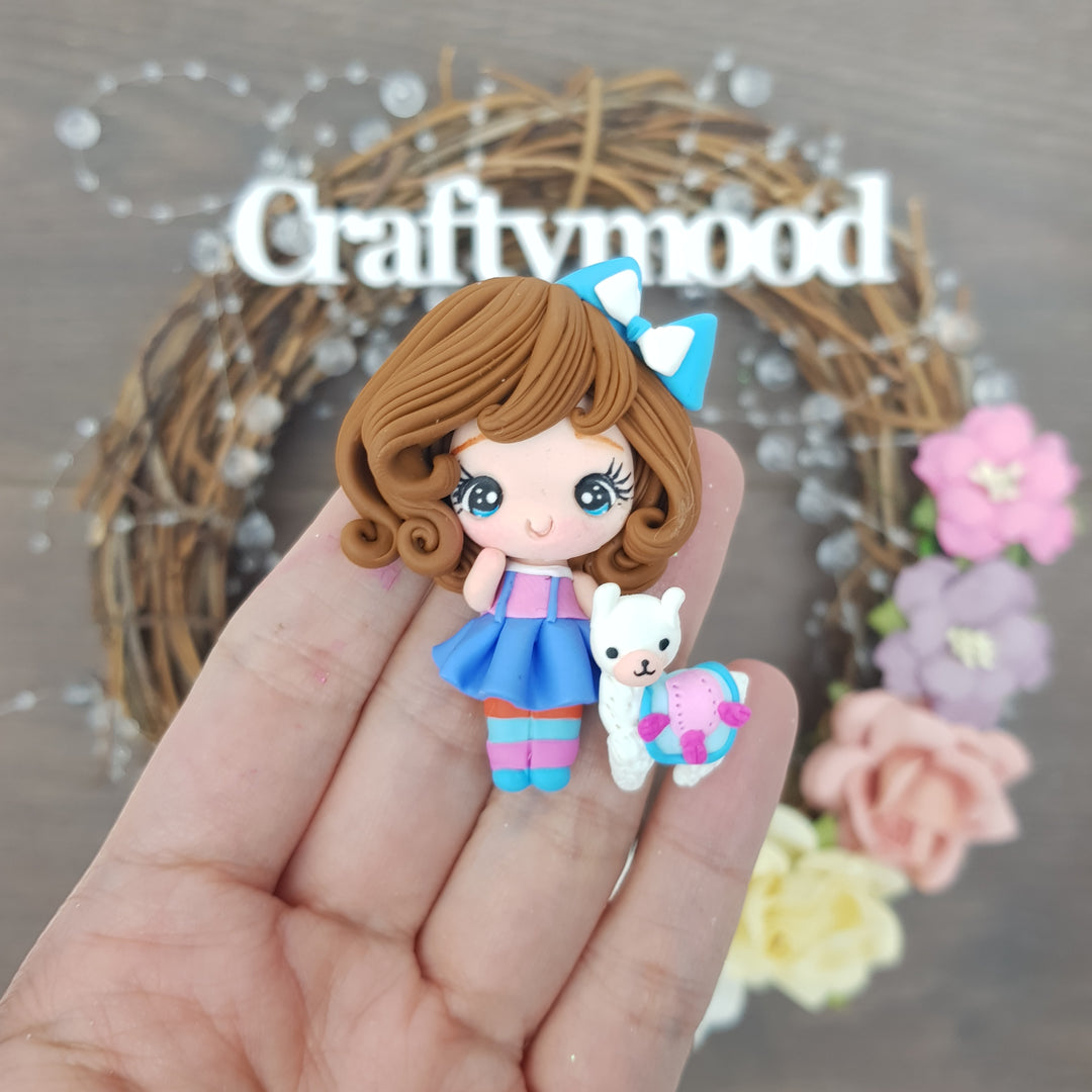 Blue dress girl and llama - Handmade Flatback Clay Bow Centre