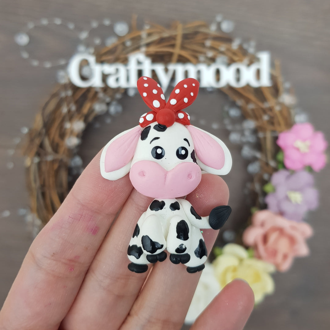 Cow sitting - Handmade Flatback Clay Bow Centre