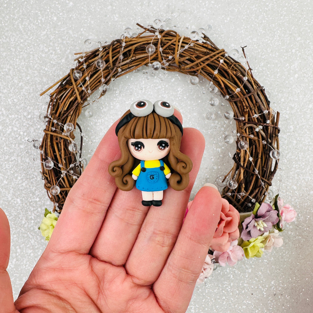 Yellow monster dressing up girl - Embellishment Clay Bow Centre