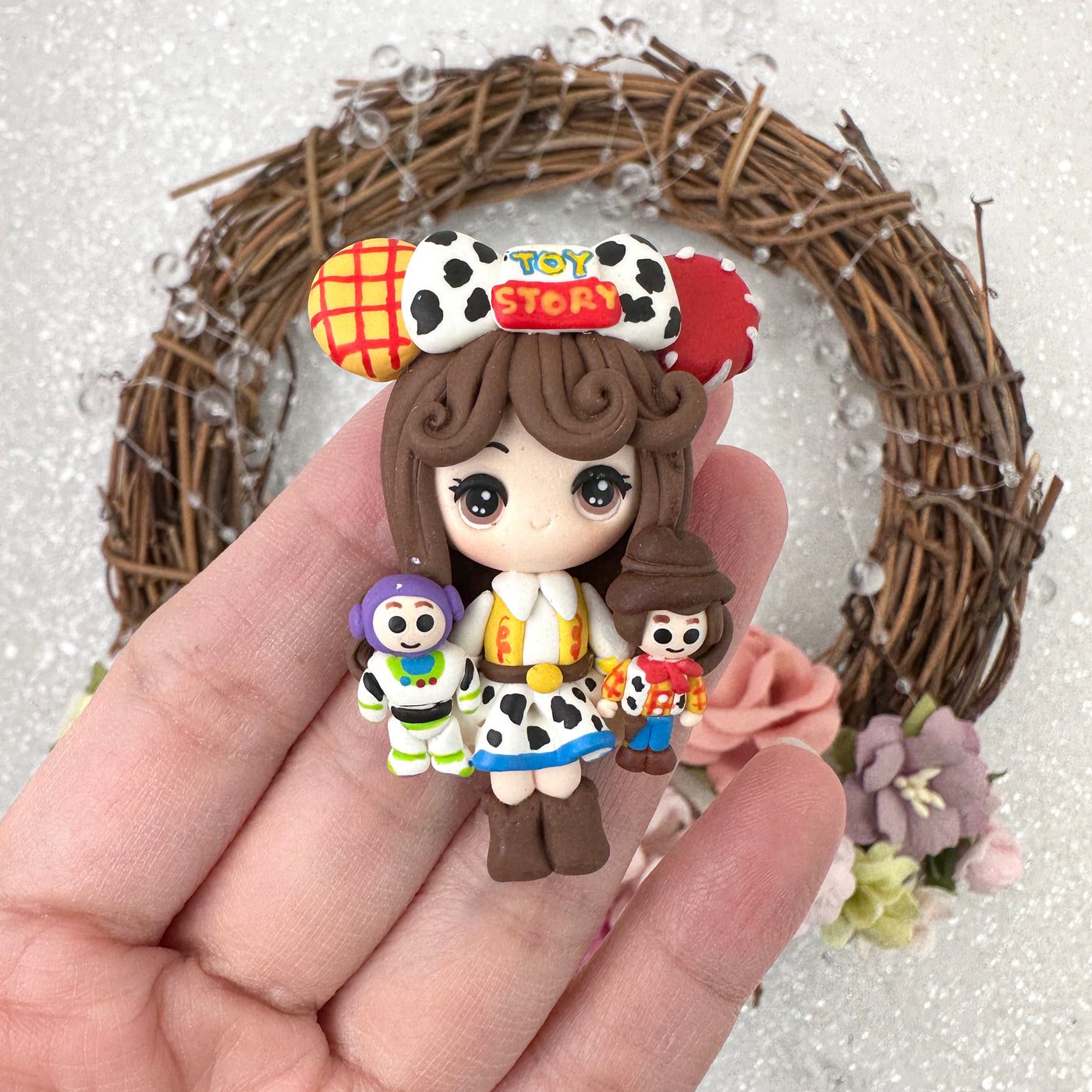 cowboy girl with doll - Embellishment Clay Bow Centre