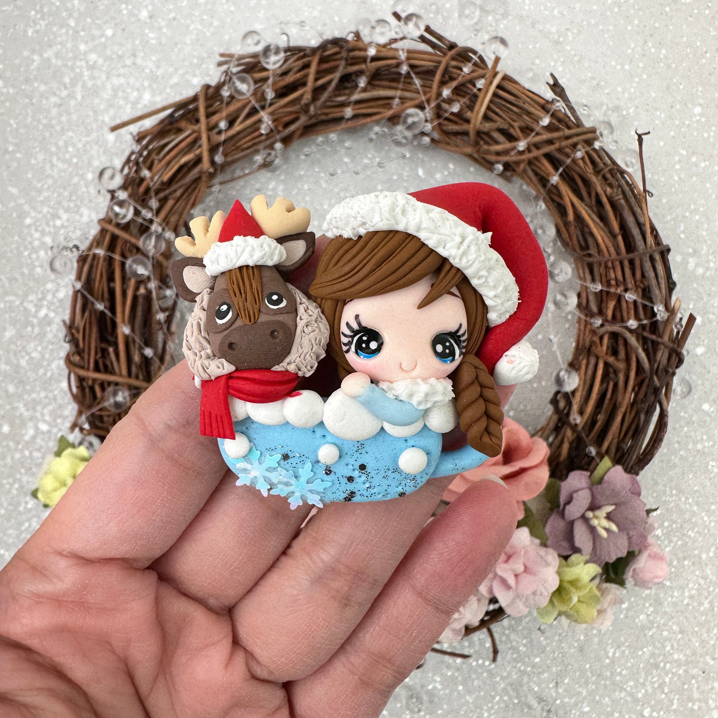 Girl on a blue cup with reindeer - Embellishment Clay Bow Centre