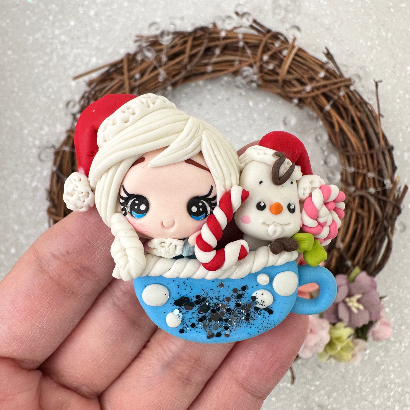 Girl on a blue cup with snowman - Embellishment Clay Bow Centre