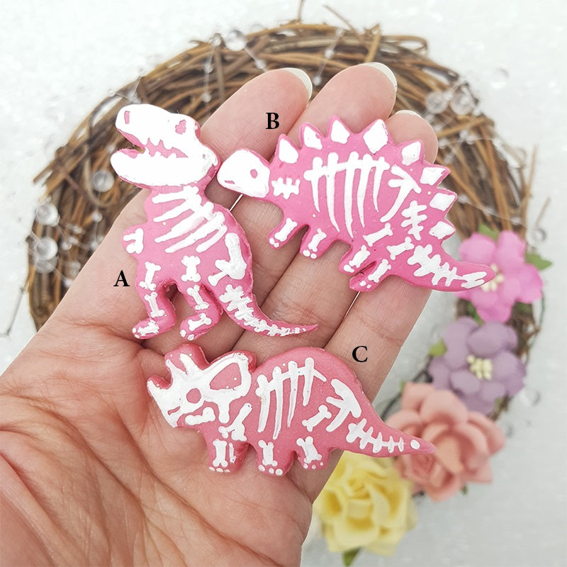 Pink skull dino fossil - Handmade Flatback Clay Bow Centre