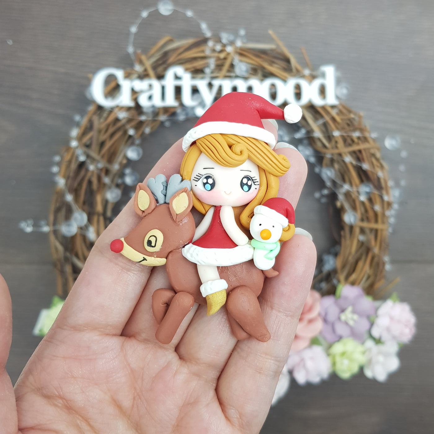 Christmas girl riding reindeer - Embellishment Clay Bow Centre